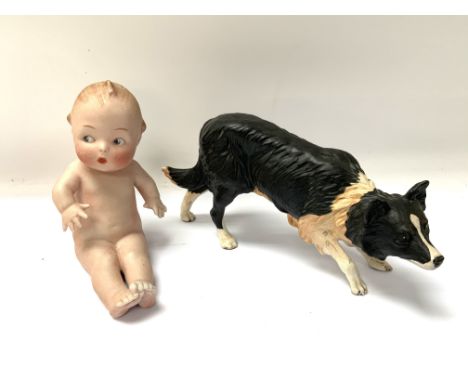 A Heubach startled Bisque piano Baby together with a Royal Doulton ceramic model of a Border Collie.