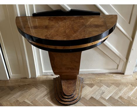 An Art deco design ebonized and maple veneered console table with quarter veneered top. 90cm x 82cm x 44cm.