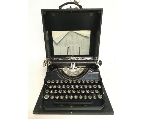 A cased Sterling Continental vintage typewriter , postage category C