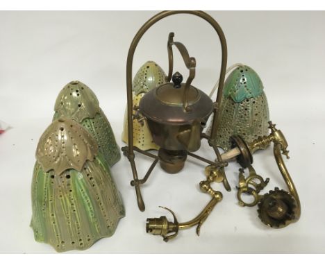 A collection of four unusual design ceramic light shades a brass and copper spirit kettle and other vintage brass light fitti