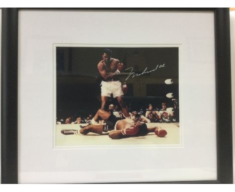 A framed and signed Muhammed Ali print with COA, approx 45cm x 40cm. Shipping category D.