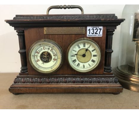 A Edwardian mahogany case inset with clock and barometer.