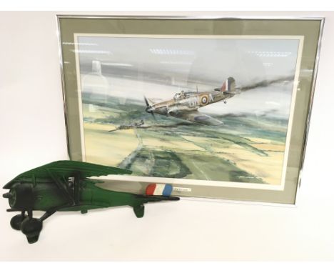 A framed print by Geoff Nutkin dated 1985 portraying a scene from the Battle of Britain, approximately frame dimensions 72 & 