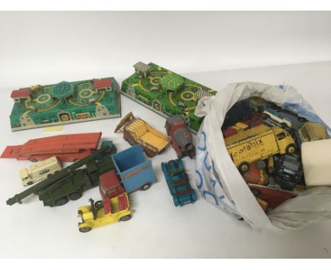 Two tin plate car roundabout clockwork tracks and a quantity of playworn vintage die-cast vehicles (a lot)