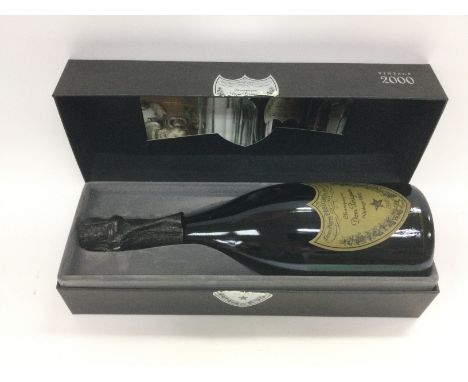 A cased bottle of Dom Perignon Vintage 2000. Shipping category D.