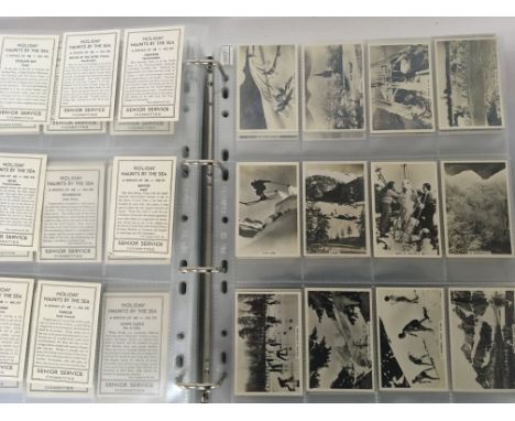 Two albums containing a good collection of vintage cigarette cards sports famous footballers Turf one sided cards black and w