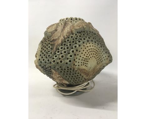 A Contemporary ceramic lamp, decorated with moulded butterfly and moth and with foliage. With an internal light by Bernard Ro