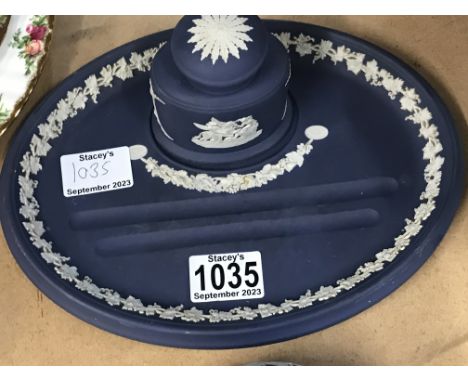 A Wedgwood inkwell on stand together with a oval box and cover .