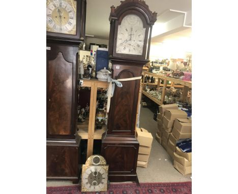 A mahogany long case clock case together with two movements- brass dial and silver dial- Mich Padbury, Chertsey / Richard Gri