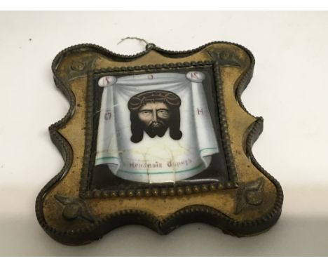 A gilt and enamel icon together with two cased icons .