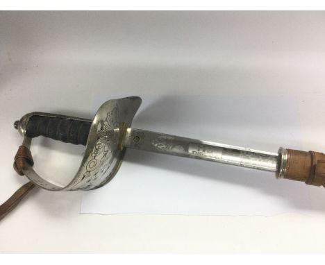 A George V officer's sword with scabbard. Shipping category D.