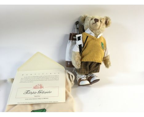 A Steiff golfer teddy bear with cloth bag. Limited Edition. Postage B.