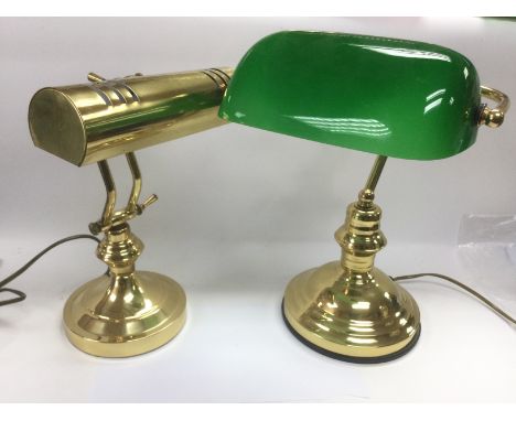 A reproduction brass table lamp and one other (2). Shipping category D.