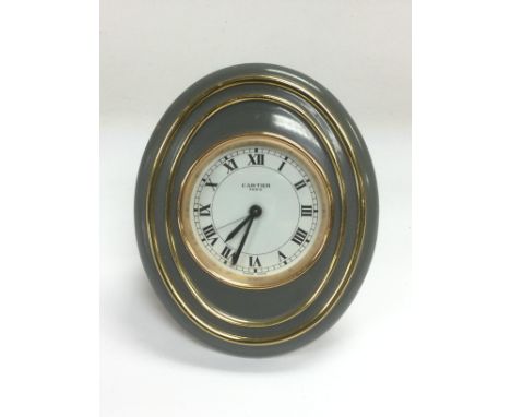 A Cartier oval alarm clock, approx height 10cm. Shipping category B.