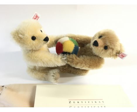 A Steiff bear limited edition. Two bears playing with a ball. Comes with cloth bag and COA. Postage B.