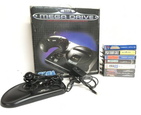 Boxed Sega Mega Drive console with a collection of games including Sonic & Knuckles, Sonic The Hedgehog 2 & World of Illusion