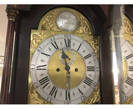 A Georgian mahogany long case clock the arched dial second subsidiary dial and date aperture. John Latham London.