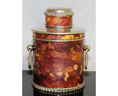 A CIRCULAR TORTOISESHELL AND PLATE TEA CADDY AND COVER.
