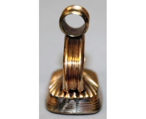 A GEORGIAN ROSE GOLD CASED FOB SEAL, the blank rounded rectangular cornelian panel with reeded and semi-fluted mount and reed