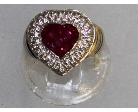 A RUBY AND DIAMOND HEART SHAPED RING, set in 18ct white gold.