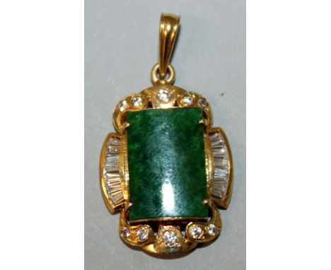 A JADE, DIAMOND AND GOLD MOUNTED PENDANT.