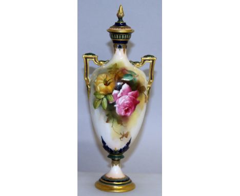 A ROYAL WORCESTER URN SHAPED TWO HANDLED VASE AND COVER, No. H 247, painted with roses. 8.25ins high.