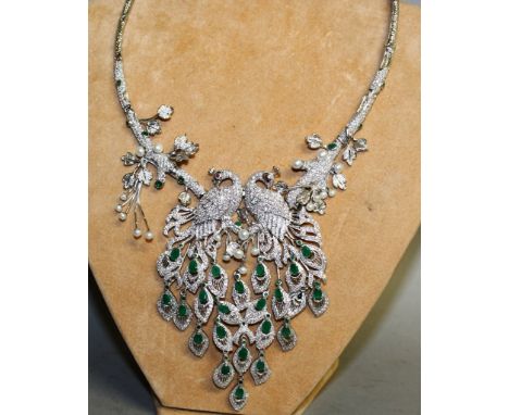 A SUPERB SILVER EMERALD, RUBY AND PEARL PEACOCK NECKLACE.