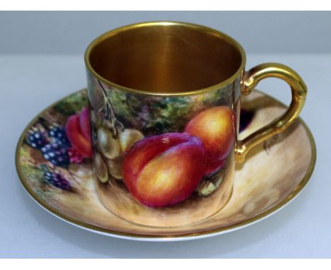 A ROYAL WORCESTER COFFEE CAN AND SAUCER painted with fruit by Freeman, signed, black mark.