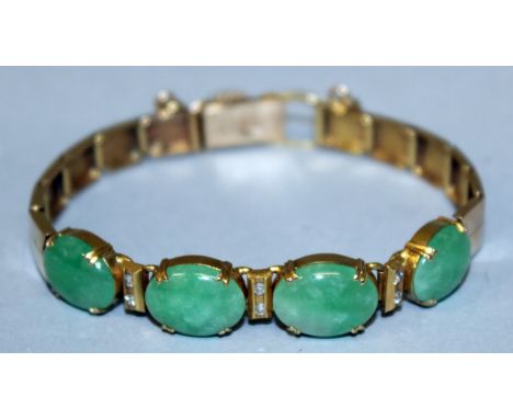 A HIGH GRADE GOLD, JADE AND DIAMOND BRACELET set with four oval jade stones and two small diamonds in between.