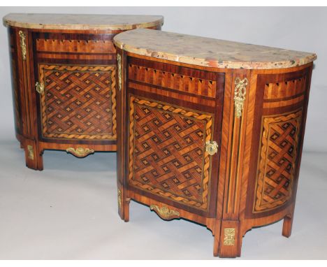 A GOOD PAIR OF LOUIS XVI DEMILUNE COMMODES with marble tops, the front and sides with parquetry inlay, single panel door and 