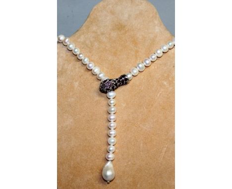 A LONG PEARL RUBY SET SNAKES HEAD CLASP NECKLACE.