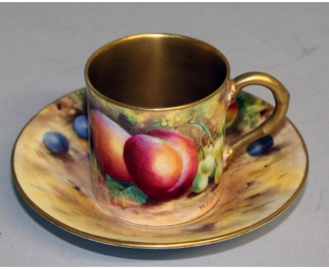 A ROYAL WORCESTER FRUIT PAINTED COFFEE CAN AND SAUCER, signed by Hale and Ayrton, puce mark, matching date code.