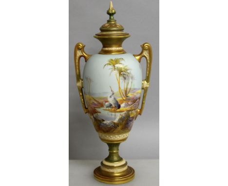 A SUPERB ROYAL WORCESTER TWO HANDLED URN SHAPED VASE AND COVER painted with storks standing in a pool, in a landscape setting