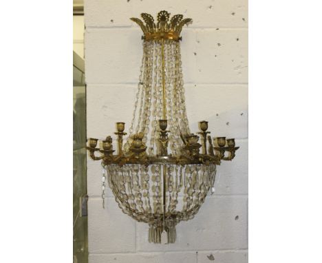 A LARGE PAIR OF 19TH CENTURY ORMOLU NINE LIGHT BOWFRONTED WALL LIGHTS with classical figures and rows of prism drops. 33ins l