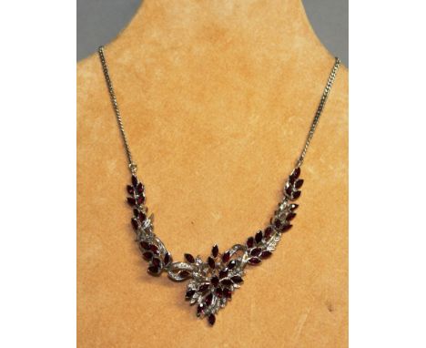 A SUPERB DIAMOND AND RUBY NECKLACE set in 18ct white gold.