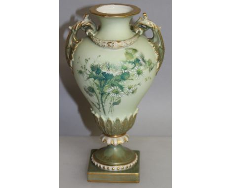 A ROYAL WORCESTER TWO HANDLED VASE painted with flowers on a blush green ground, puce mark.