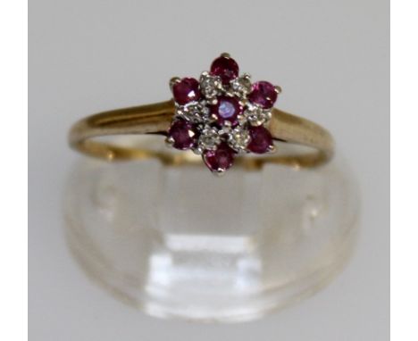 A SMALL GOLD SET RUBY AND DIAMOND RING.