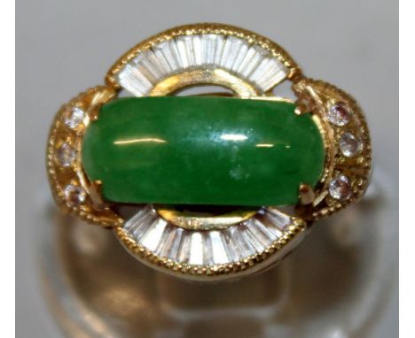 A GOOD GOLD, JADE AND DIAMOND RING, central jade with baguette diamonds.