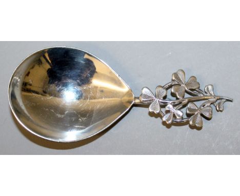 A VICTORIAN SILVER CADDY SPOON with shamrock handle. Chester 1899.  Maker: Montague Friedlander.