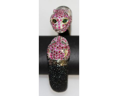 A GOOD RUBY SET SILVER AND SHAGREEN PANTHER BANGLE.