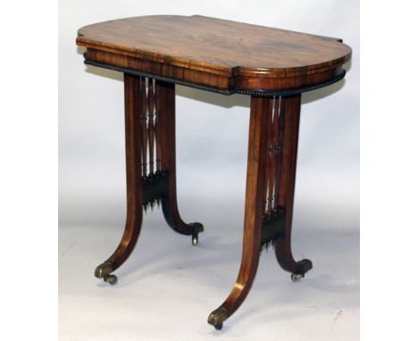 A REGENCY ROSEWOOD GILLOWS TABLE with shaped bow front ends, bobbin turned sides and supported on curving hockey stick legs w