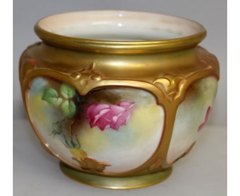 A ROYAL WORCESTER CIRCULAR ROSE BOWL, No. F 132, painted with four panels of roses. 5.5ins diameter.