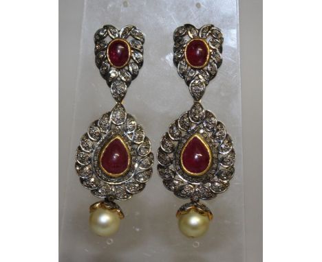 A LARGE PAIR OF DIAMOND SET AND CABOCHON RUBY DROP EARRINGS with a pearl.