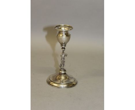 A CIRCULAR CANDLESTICK with cast female figure stem.  5.5ins high.