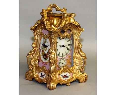 A GOOD FRENCH SEVRES AND ORMOLU CLOCK in ornate case with scrolls, acanthus and figures, complete with painted porcelain pane