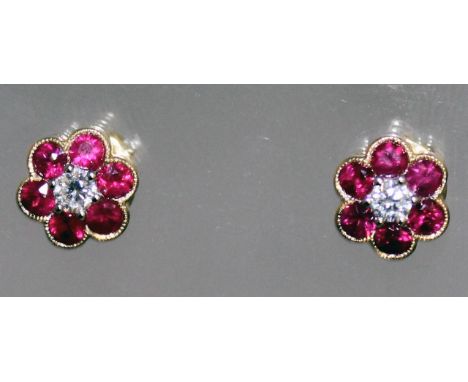 A PAIR OF RUBY AND DIAMOND 18CT GOLD CLUSTER EARRINGS.