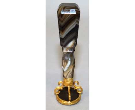 AM AGATE HANDLED DESK SEAL, the oval intaglio incised with a female portrait profile, with gold scroll mounts and tapered fac