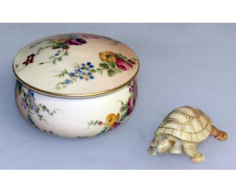 A ROYAL WORCESTER RARE TORTOISE from the Netsuke series and a Royal Worcester blue ivory floral powder box and cover, both pu