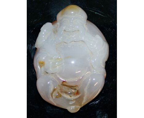 A CHINESE CARVED JADE FIGURE.