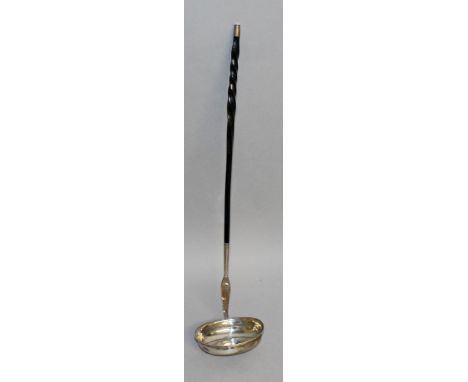 A GEORGIAN SILVER TODDY LADLE inset with a coin.